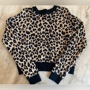 Girls cheetah Sweater size Large.
